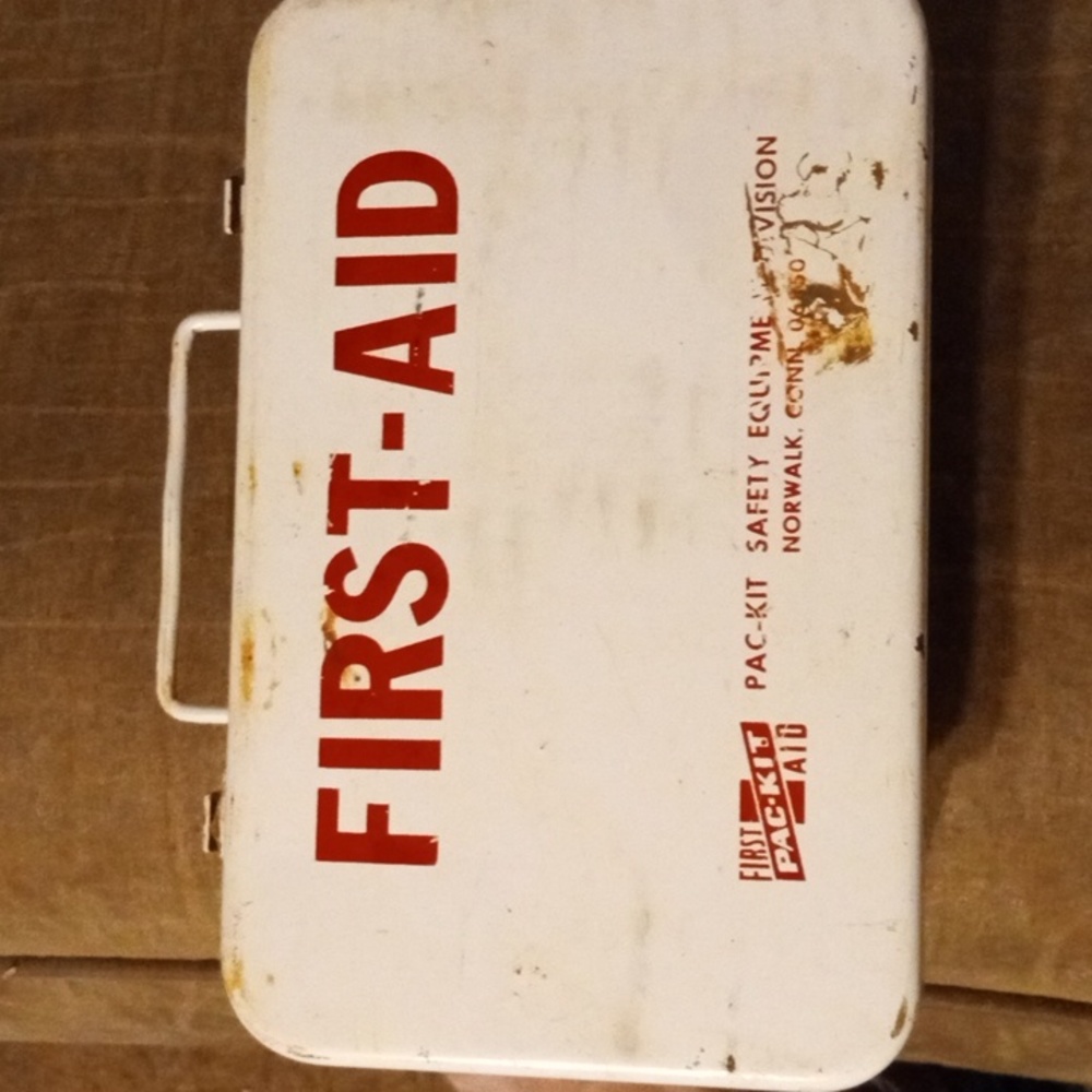 Vintage First Aid kit with all the stuff in it